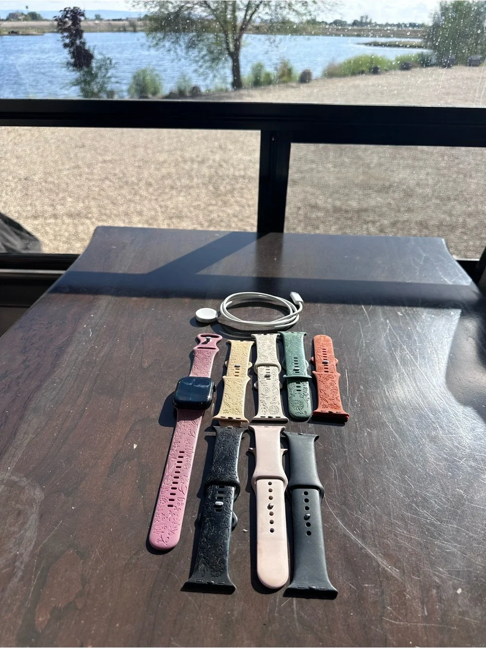 Apple Smartwatch with Black Case and Light Pink Sport Band